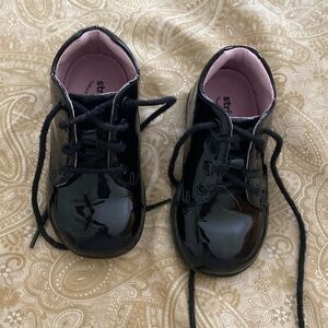 Gently used baby black patent leather shoes